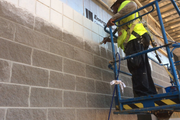 Commercial Painting Tips | Performance Painting Painter painting wall